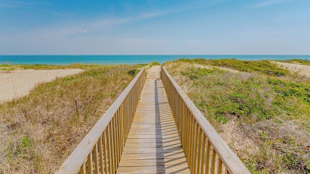A wooden boardwalk leading to the beach. - JL #BR-9 - The Breakers 9 - Oceanfront - Community Pool (Kill Devil Hills)