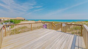 A wooden deck with a view of the beach and ocean. - JL #BR-9 - The Breakers 9 - Oceanfront - Community Pool (Kill Devil Hills)
