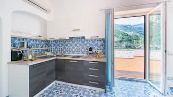 Apartment, 2 Bedrooms, Sea View | Private kitchen | Fridge, stovetop, espresso maker, electric kettle