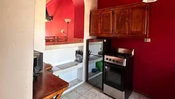 Departamento, balcón, vista a la ciudad | Cocina privada