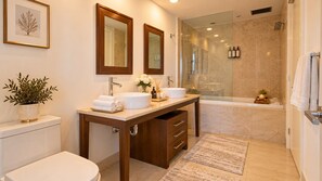 A modern bathroom with a double sink vanity, a glass shower enclosure, and a toilet. - Icon Brickell - 31st Floor - Ocean View - Free Spa (Miami)