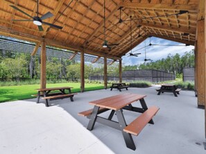 Outdoor dining - Wildlight Retreat Pool · Pickleball · Canopy Bed (Yulee)