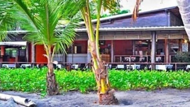 A building with a covered outdoor area, surrounded by greenery. - La Sagesse Bay View (St. David)
