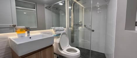 Shower, hair dryer, towels, soap
