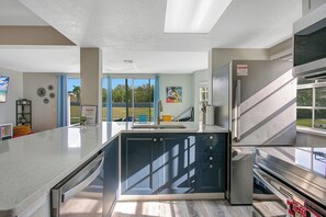 Fridge, microwave, oven, stovetop - Disney Themed Home - Pool + Pond View near Disney Parks - Family fun (Davenport)