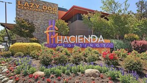 A sign for Lazy Dog Restaurant & Bar and Hacienda Crossings.