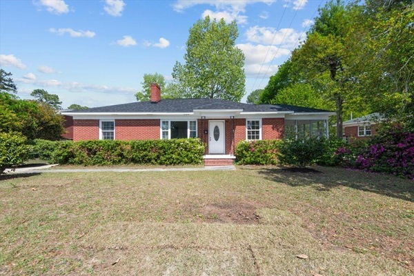 Front of home with seaonal azealas