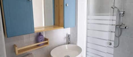 Shower, hair dryer, towels, soap