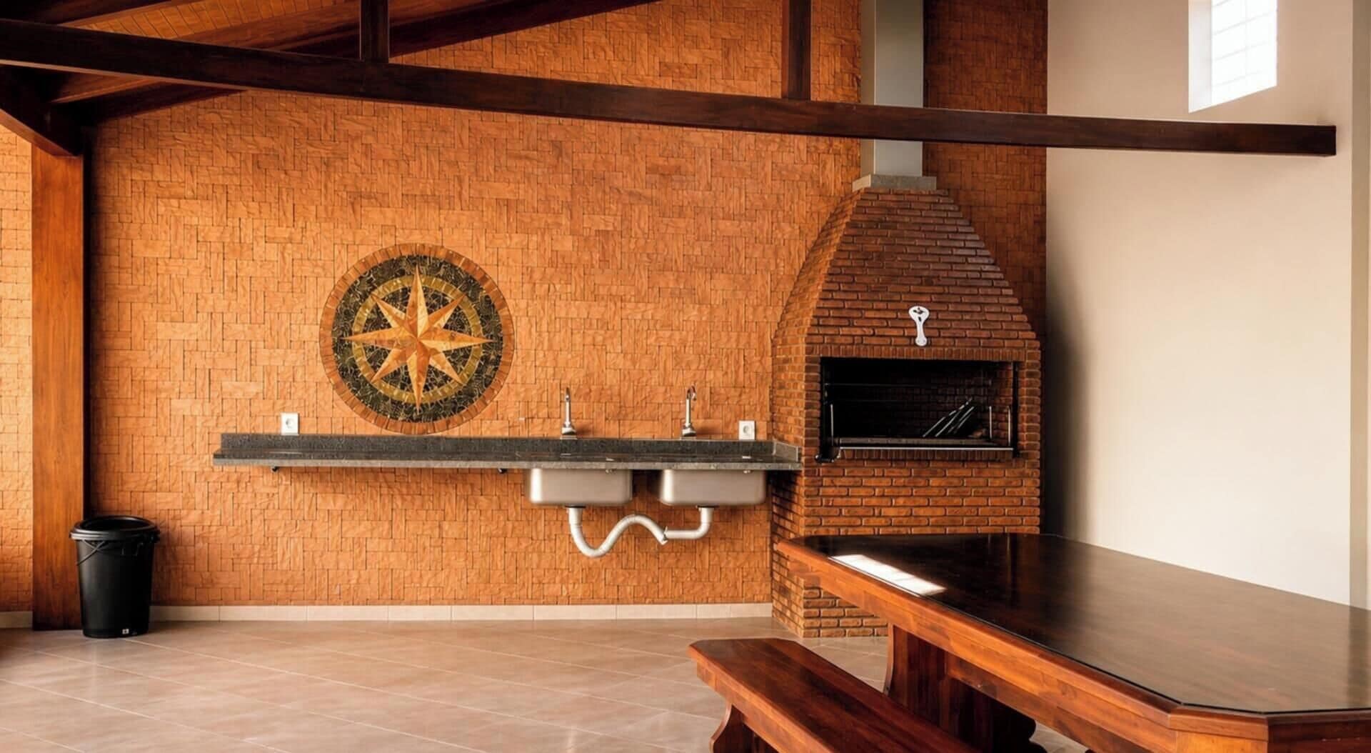 A brick wall with a compass design, a brick oven, and a wooden bench.