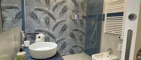 Hair dryer, bidet, towels, soap