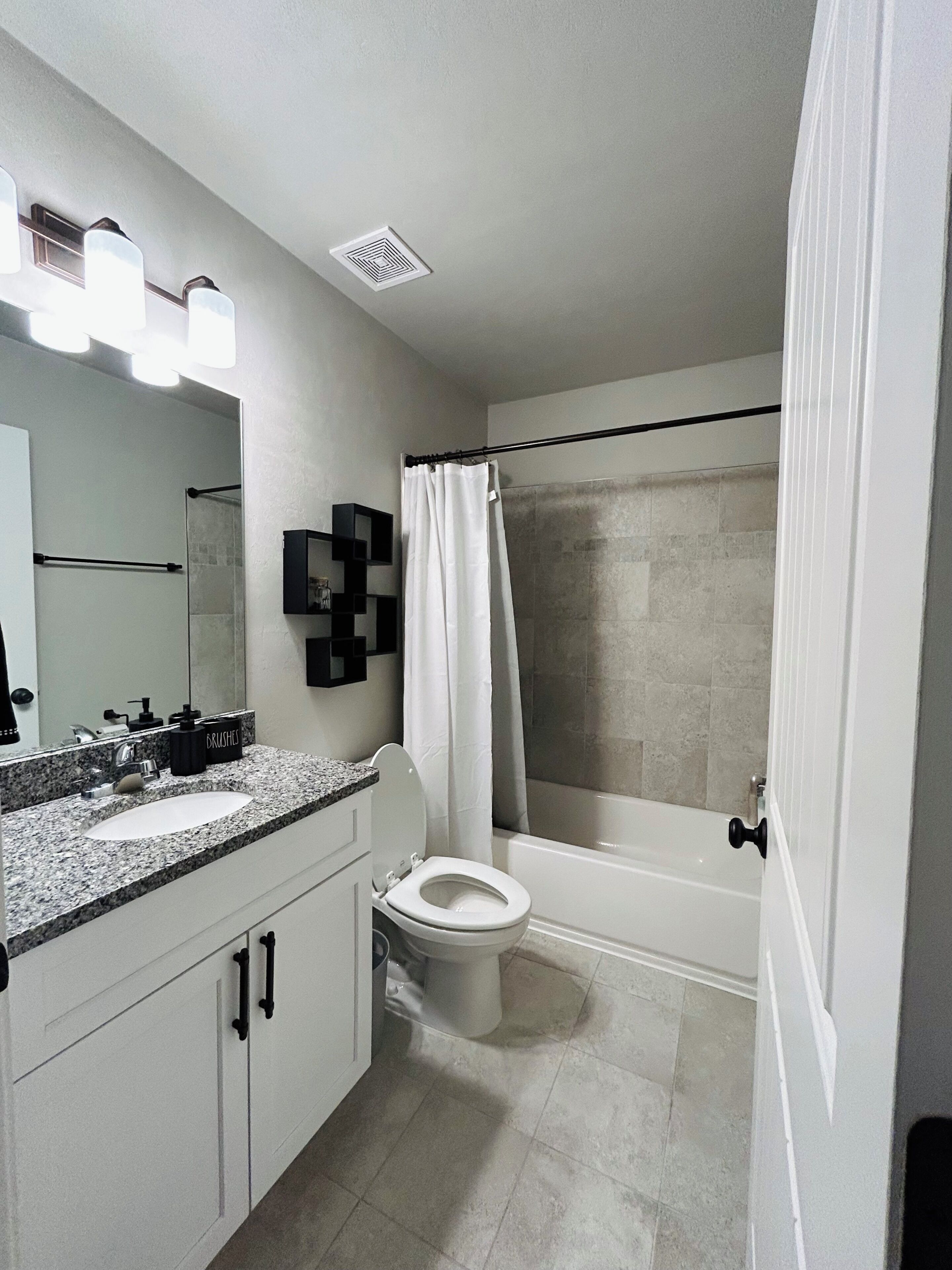 Shower, hair dryer, towels, toilet paper