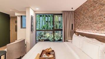 Deluxe King Suite | In-room safe, desk, laptop workspace, free WiFi