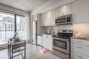 Fridge, microwave, oven, stovetop - Chic Loft Near Old Port | Prime Spot (Montreal)