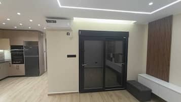 Apartemen Deluks, AC, pemandangan laut | Interior