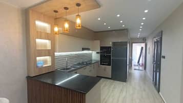 Apartamento luxo, ar-condicionado, vista para o mar | Cozinha privada