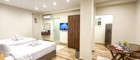 Deluxe Triple Room, Balcony, City View | In-room safe, blackout drapes, soundproofing, iron/ironing board