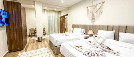 Deluxe Triple Room, Balcony, City View | In-room safe, blackout drapes, soundproofing, iron/ironing board
