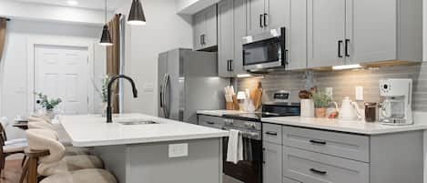 Coffee/tea maker, fridge, microwave, oven