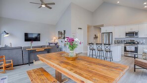 A modern kitchen with white cabinets, a stainless steel oven, and a microwave. - Coach-ella on the Lake - Ideal Canandaigua Lake Couples Retreat! (Canandaigua)