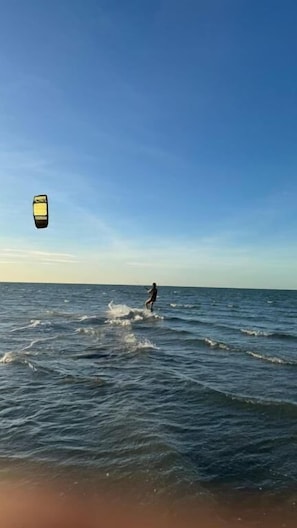 A person windsurfing on the ocean with a clear sky. - Guajiru kite Safari  (Itarema)