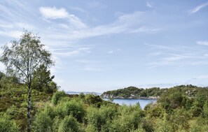 A natural landscape with a body of water, trees, and a distant landmass. - Beautiful home in Mosterhamn with WiFi (Mosterhamn)