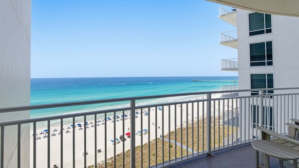A balcony with a view of a beach and ocean. - 3 Bedroom in Aqua Resort! 811 Renovated with Gorgeous Views!  New listing (Panama City Beach)