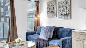 Family Suite, 2 Bedrooms, Non Smoking, Air conditioning | Living area | 50-inch flat-screen TV with digital channels