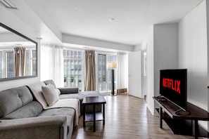 Comfort Suite, 1 Bedroom, Non Smoking, Air conditioning | Living area | 50-inch flat-screen TV with digital channels