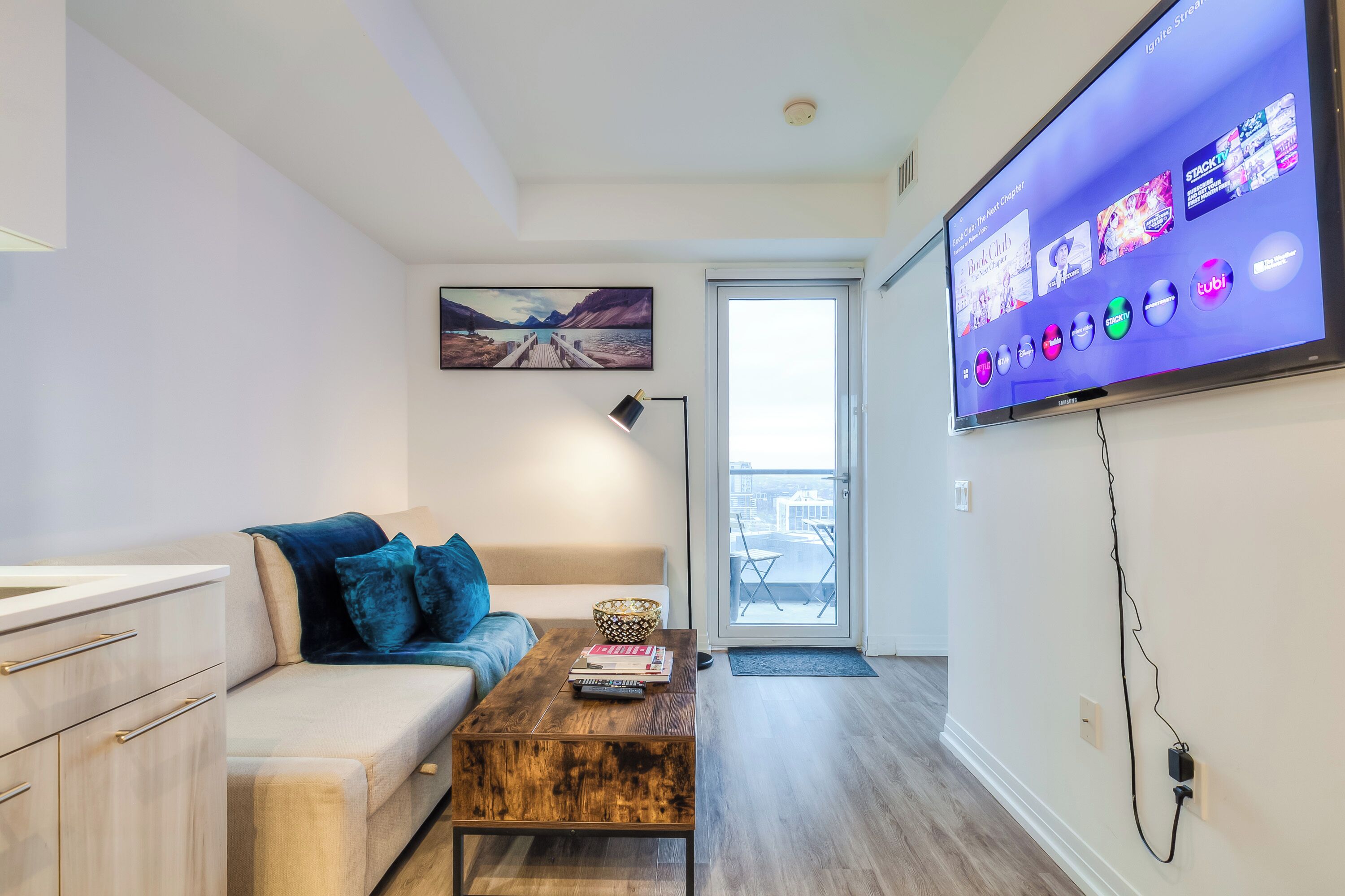 Suite Deluxe, varias camas, para no fumadores, vista a la ciudad | Área de sala de estar