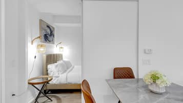 Family Suite, 2 Bedrooms, Non Smoking, Air conditioning | Living area | 50-inch flat-screen TV with digital channels