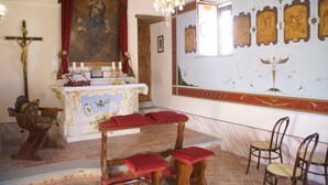 A church interior with a wooden altar, a crucifix, and a large religious painting. - Holiday Home in Citta di Castello With Pool (Città di Castello)