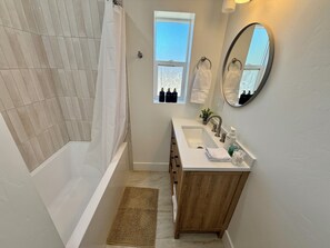 Shower, towels, soap, toilet paper