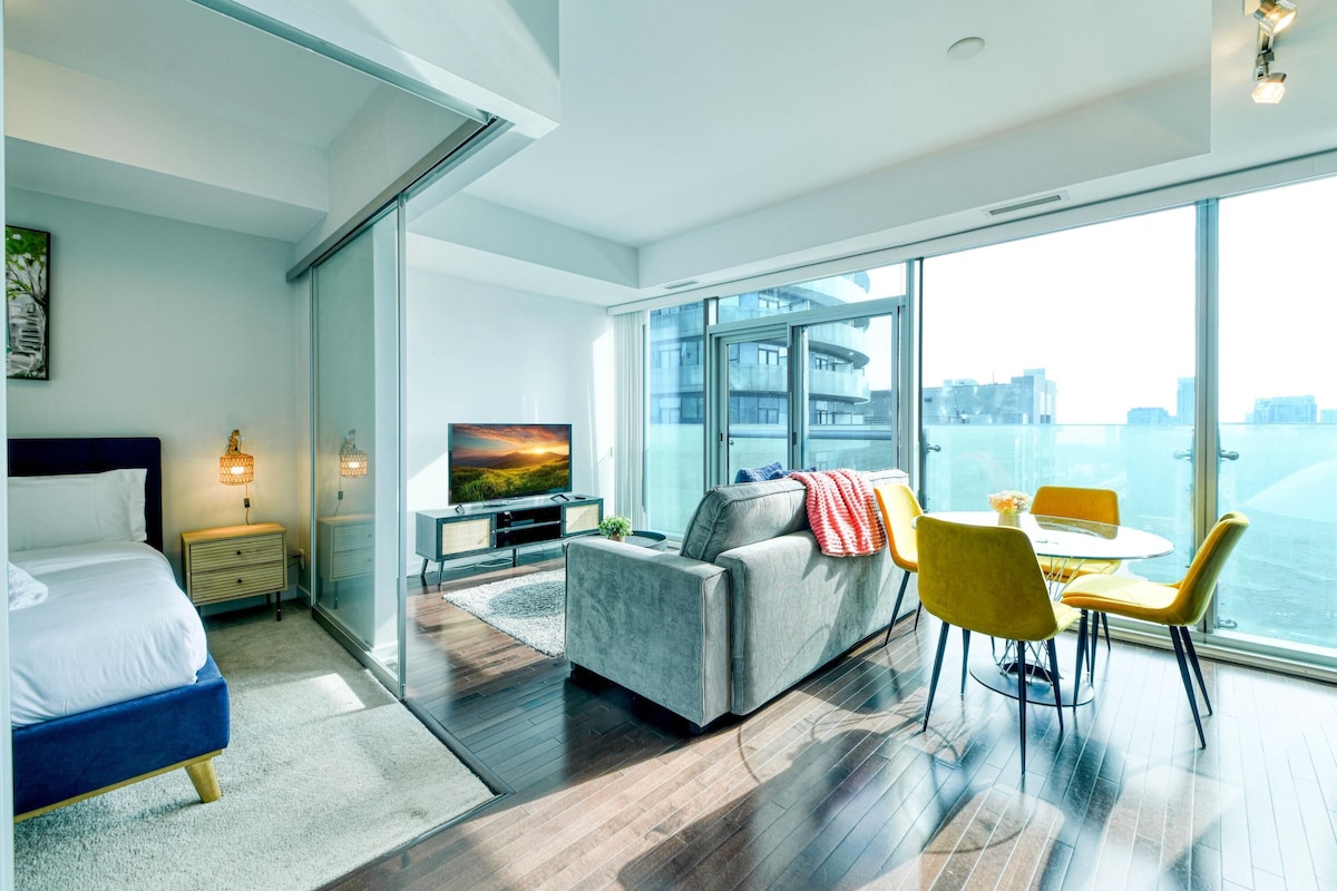 Luxury Suite | Living area | 55-inch TV with digital channels