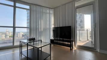 Deluxe Suite, Non Smoking | Living area | 55-inch TV with digital channels