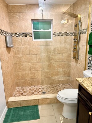 Shower, towels, soap, toilet paper