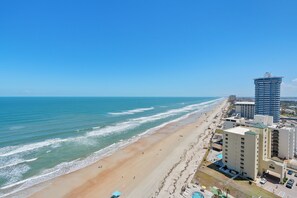 Birds eye view of the beach from your private balcony. - Enjoy this 20th floor 2BR/2BA penthouse condo in Daytona Shores with stunning ocean views from the living area, master bedroom, and balcony. Sherwin amenities include a heated pool, fitness center, sauna, hot tub, and indoor garage parking. (Daytona Shores)