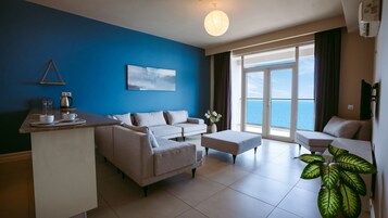 Junior Suite, Balcony, Sea View | Living area | 45-inch LCD TV with satellite channels
