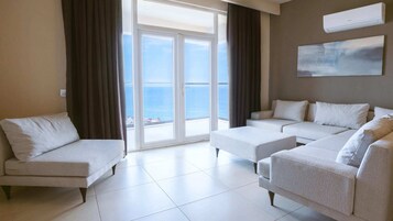 Deluxe Suite, Balcony, Sea View | Living area | 45-inch LCD TV with satellite channels