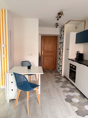 A modern kitchen with white cabinets, a coffee maker, and a microwave. - Quiet Elegance Near Lake Annecy Giez (Faverges-Seythenex)