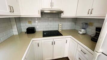 Fridge, microwave, toaster, cookware/dishes/utensils