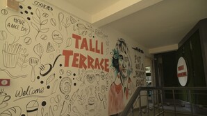 A wall with doodles and text, including 'TALLI TERRACE' and 'Welcome'. - The Tulip Regency (Jaipur)