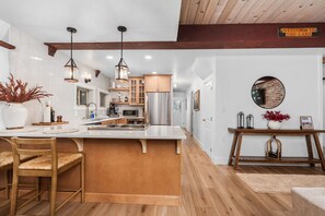 Private kitchen - Spread out across three levels, this cozy A-frame offers space for everyone to unwind—from the open main living area to the upstairs lounge and playful loft. A great fit for families or small groups looking for comfort and a little fun. (Shaver Lake)