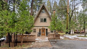 Exterior - Spread out across three levels, this cozy A-frame offers space for everyone to unwind—from the open main living area to the upstairs lounge and playful loft. A great fit for families or small groups looking for comfort and a little fun. (Shaver Lake)