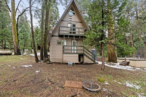 Exterior - Spread out across three levels, this cozy A-frame offers space for everyone to unwind—from the open main living area to the upstairs lounge and playful loft. A great fit for families or small groups looking for comfort and a little fun. (Shaver Lake)