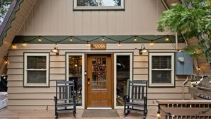 Terrace/patio - Spread out across three levels, this cozy A-frame offers space for everyone to unwind—from the open main living area to the upstairs lounge and playful loft. A great fit for families or small groups looking for comfort and a little fun. (Shaver Lake)