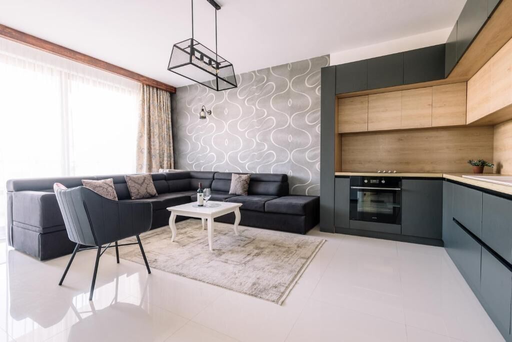 Apartamento luxo, 1 cama King e sofá-cama, vista para a cidade | Área de estar