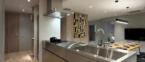 Design Apartment | Private kitchen | Fridge, microwave, stovetop, cookware/dishes/utensils
