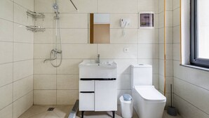 A modern bathroom with a shower, sink, toilet, and a window. - Olchazor hotel (Tashkent)