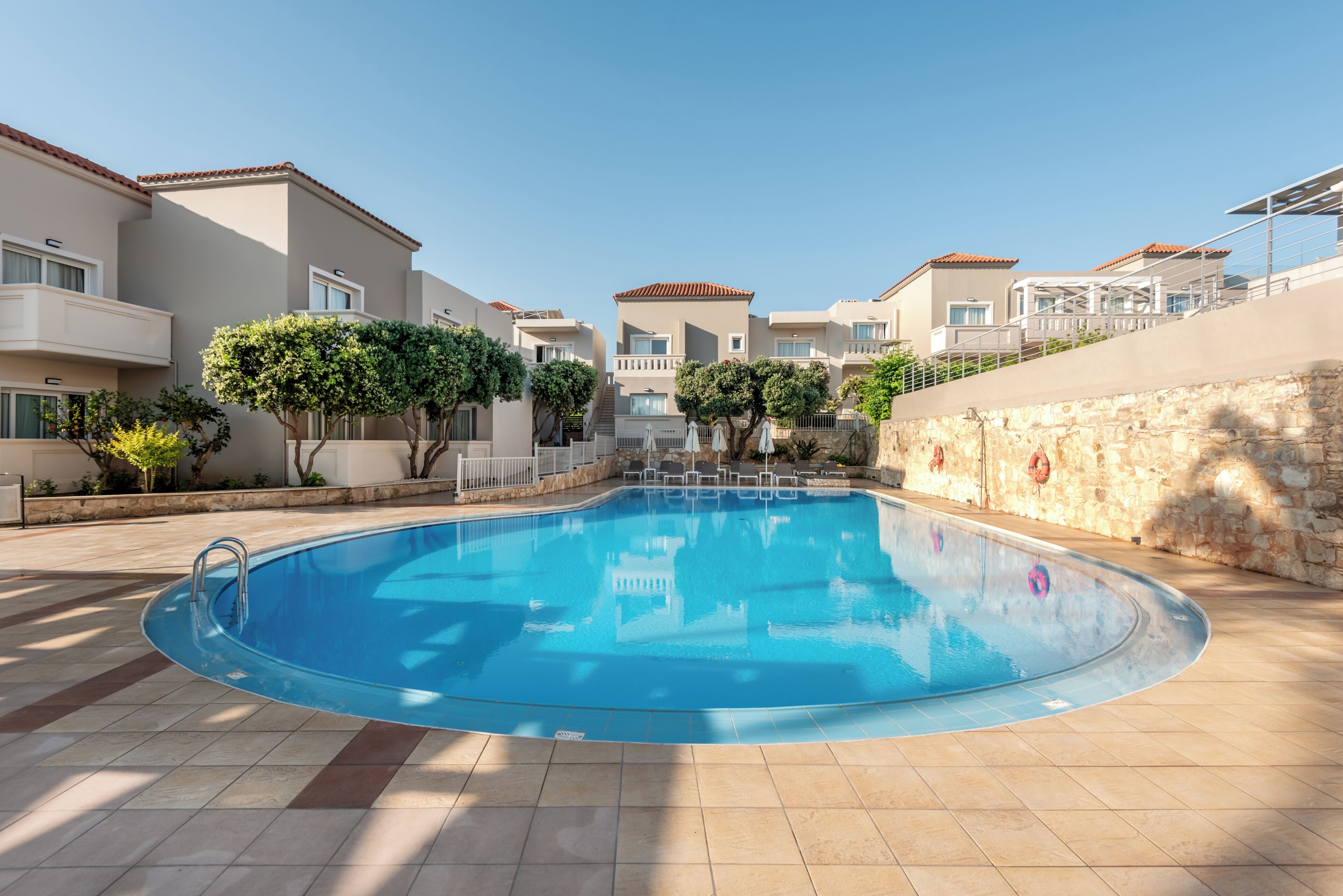 Seasonal outdoor pool, pool loungers