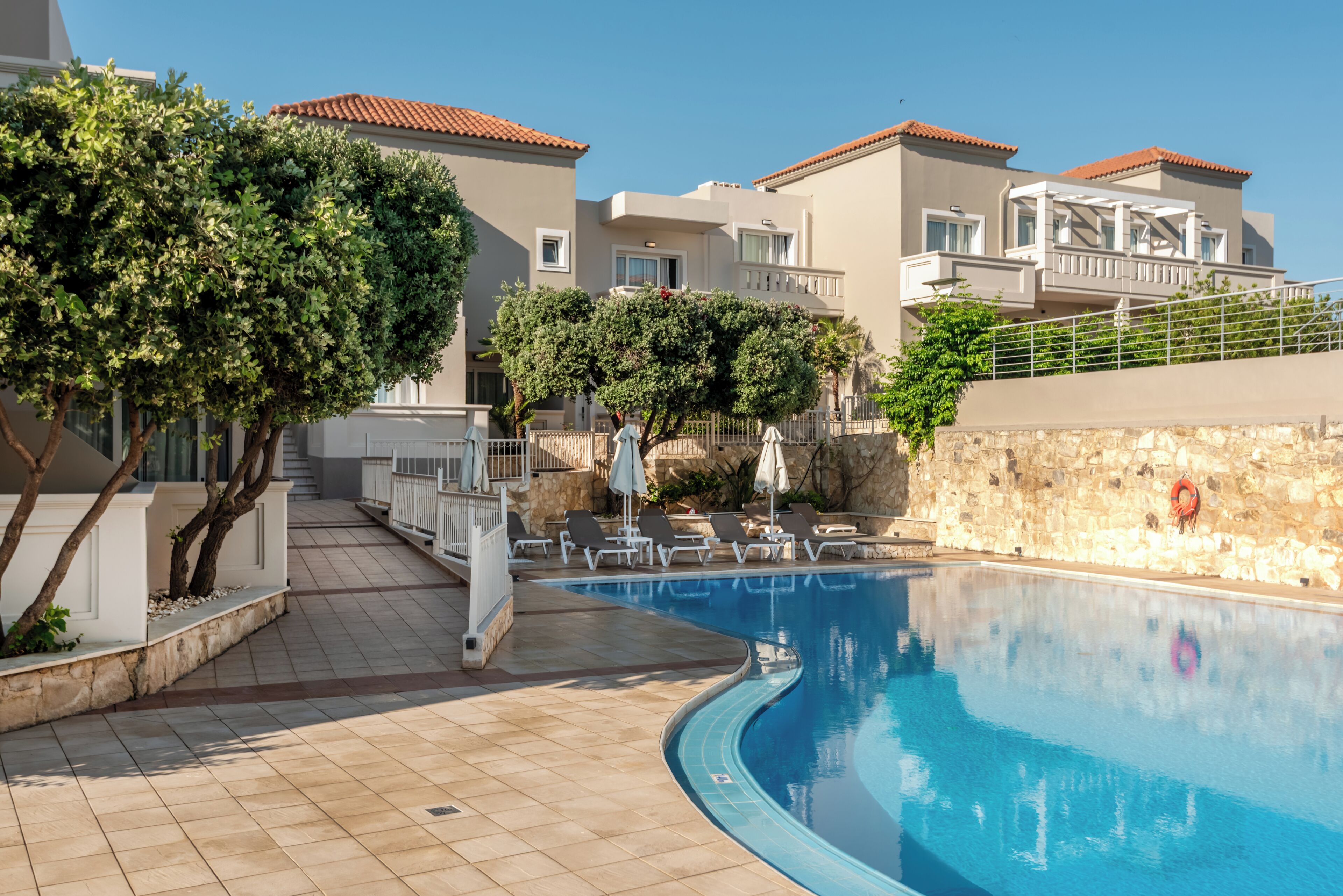 Seasonal outdoor pool, pool loungers